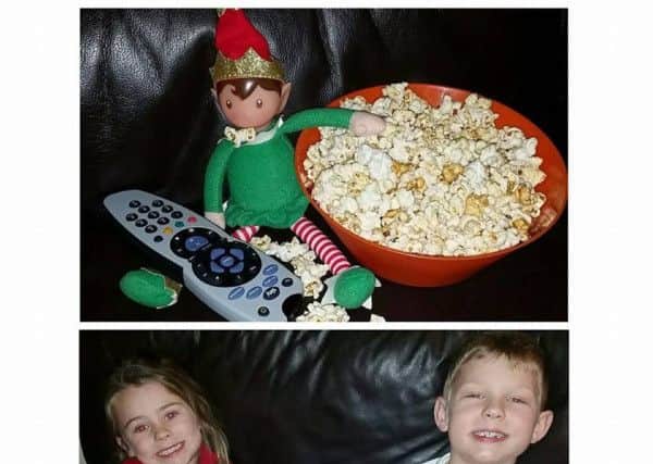 Tyler bentham, age seven, and Ellie Hayes, age four, with their film-loving elf. Picture: Jade Bentham