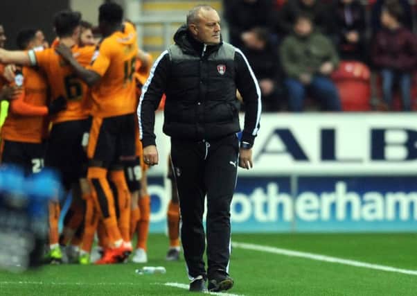 Rotherham manager Neil Redfearn looks on as the Wolves players celebrate their second goal.