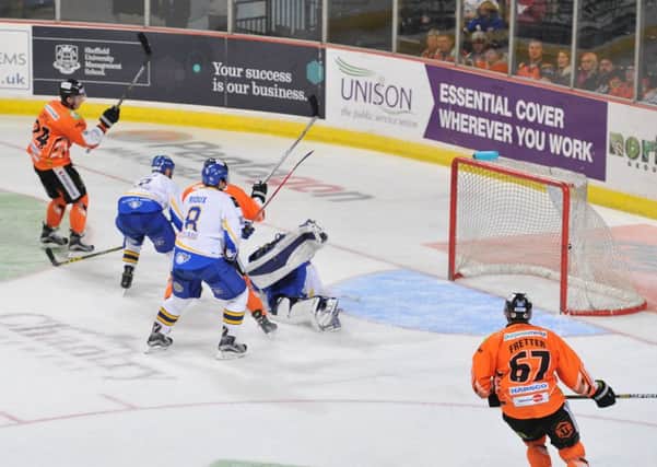 HOW'S THAT FOR STARTERS? Jace Coyle, far left, opens the scoring for Sheffield Steelers against Fife Flyers on Sunday night. Picture: Dean Woolley.
