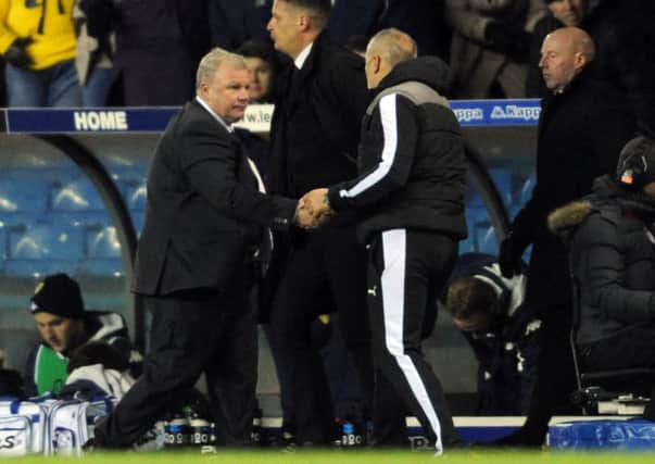 Leeds United manager Steve Evans shakes hands with his Rotherham United counterpart Neil Redfearn (Picture: Simon Hulme).
