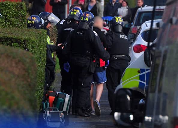 Police arreat a man after an armed siege at a house in Bramley, Leeds. Picture by Tony Johnson