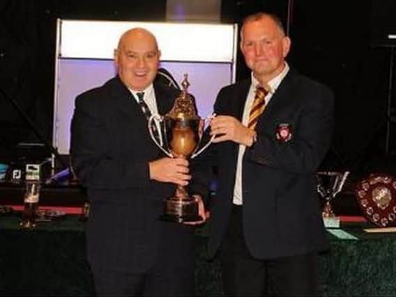 Alan Puddyford receives the Drax GC Golfer of the Year trophy from Garryk Slaywe.