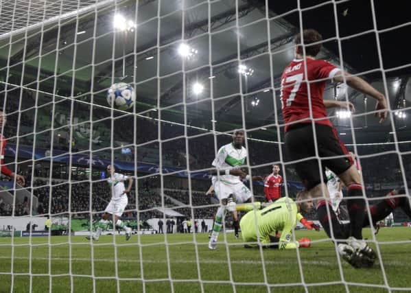 ALL OVER: Naldo, second left, scores Wolfsburgs winning goal against Manchester United on Tuesday night. Picture: AP