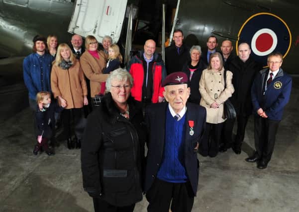 Normandy Veteran Joseph Murphy, from Burley, Leeds, is presented with the Légion dHonneur by his family at Yorkshire Air Museum, York with Jane Thompson, his god-daughter