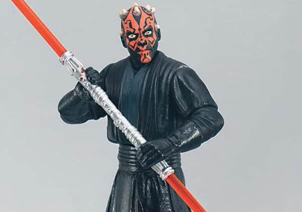 A figurine of Darth Maul, one of a range of toys from Star Wars: Episode I - The Phantom Menace.  Star Wars./PA