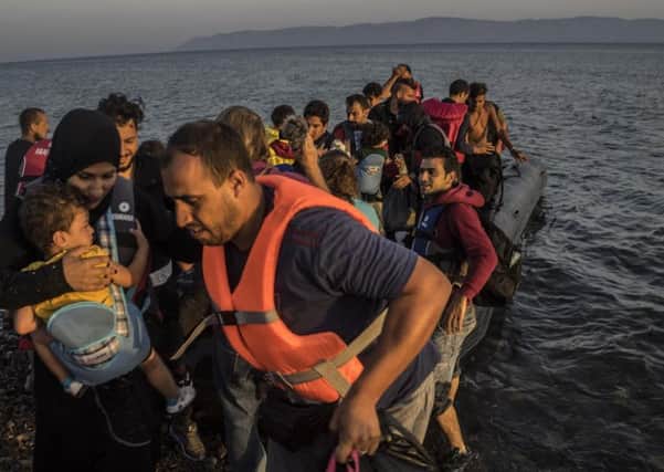 A group of Syrian, Afghan and Palestinian refugees arriving off the coast of Lesvos. Greece.