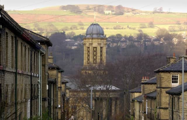 Saltaire United Reform Church and Baildon Moor from the terraces.