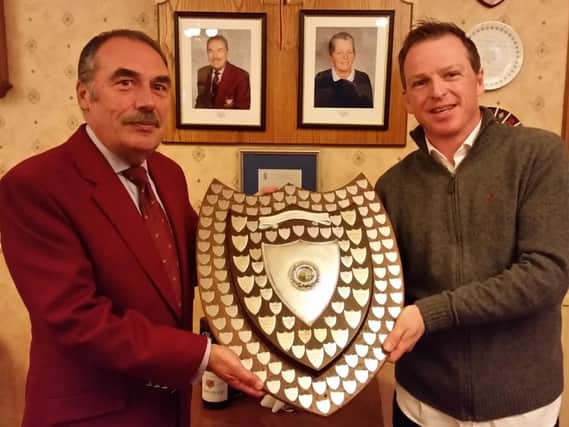 Thirsk & Northallerton's men's captain Dave Brown, left, and Dales Alliance captain Andy Bell show off the league trophy.