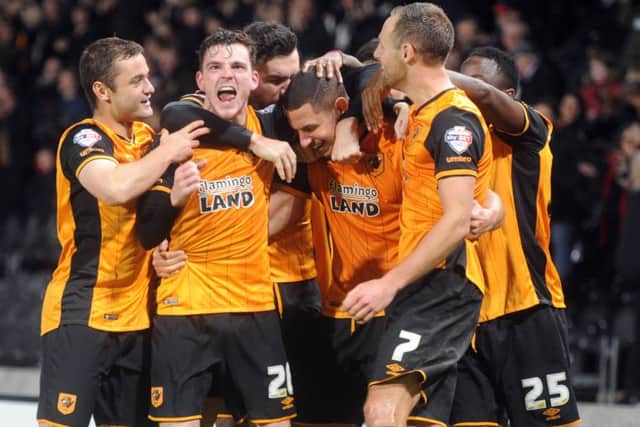Hull City captain Jake Livermore is mobbed after his late winner. Picture: Tony Johnson