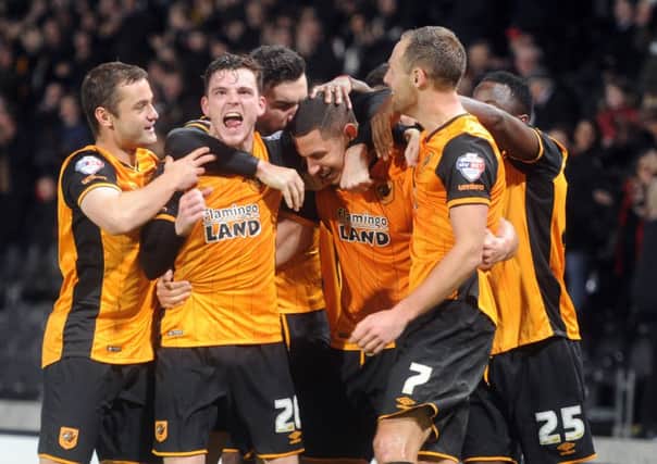Hull City captain Jake Livermore is mobbed after his late winner. Picture: Tony Johnson