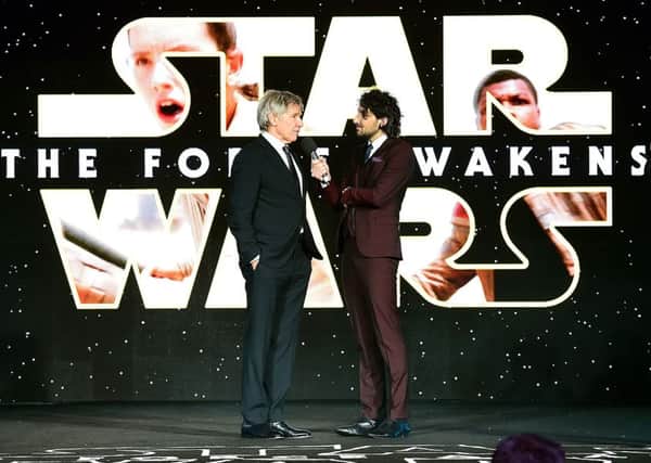 Harrison Ford and Alex Zane on stage during the Star Wars: The Force Awakens European Premiere held in Leicester Square, London.