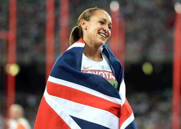 Great Britain's Jessica Ennis-Hill celebrates winning gold in the Women's Heptathlon after winning the 800m, during day two of the IAAF World Championships at the Beijing National Stadium, China. PRESS ASSOCIATION Photo. Picture date: Sunday August 23, 2015. See PA story ATHLETICS World. Photo credit should read: Martin Rickett/PA Wire. RESTRICTIONS: Editorial use only. No transmission of sound or moving images and no video simulation. Call 44 (0)1158 447447 for further information