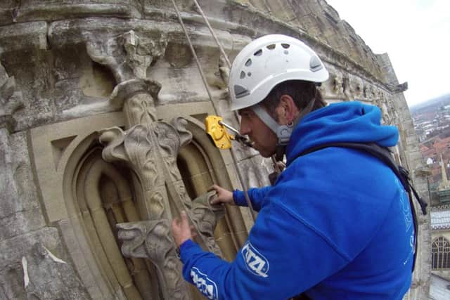 The restoration work of the Minster's East End has involved abseiling conservation work which was carried out by Heritage Stone Access.  Pic: Ross Parry.
