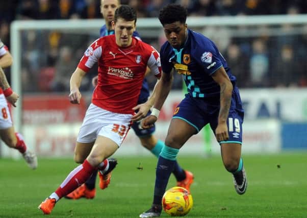 Hull's Chuba Akpom is challenged by Richie Smallwood. (Picture: Simon Hulme)
