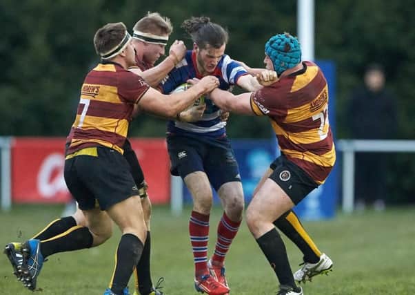 Joe Cribley of Sheffield RUFC holds on to the ball as he is outnumbered in the game v Sheffield Tigers RUFC
