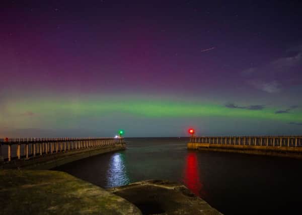 James Hewitson's picture of the northern lights seen over the pier ends in Whitby last night