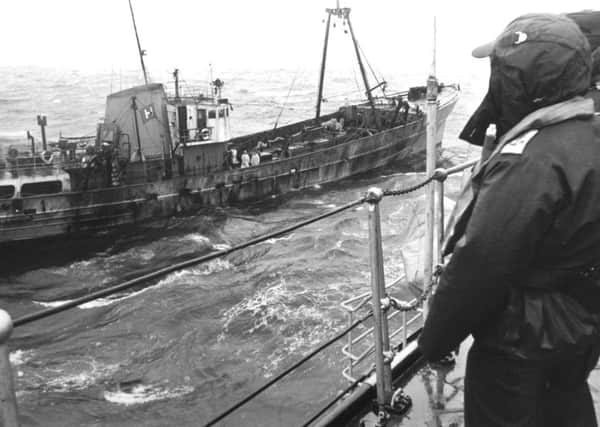 Crew on a British frigate give a watchful guard to a trawler during the Cod War in 1976. (Picture: Courtesy Hull Maritime Museum)