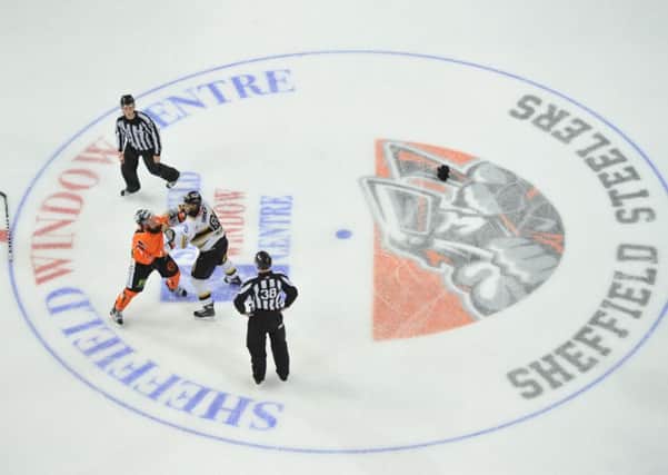 THE GLOVES ARE OFF: Sheffield Steelers Jason Hewitt gets to grips with Nottingham Panthers Jeff Dimmen during the last meeting between the two Elite League clubs at Sheffield Arena last month. The rivals meet again at the same venue on Boxing Day. Picture: Dean Woolley