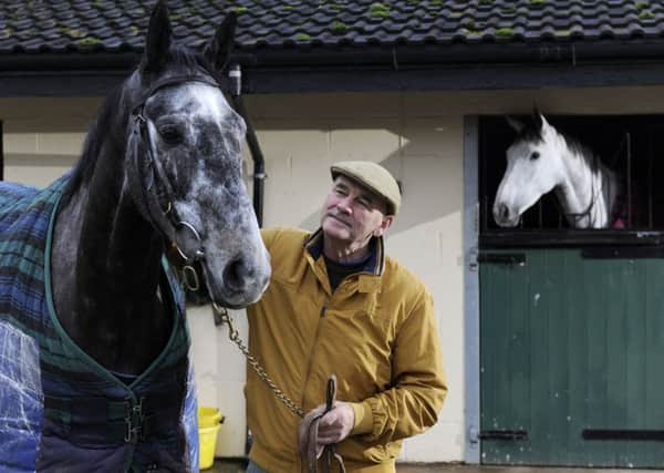 Racehorse trainer Malcolm Jefferson of Newstead Cottage Farm, Norton, with Cloudy Dreams, one of his horses that could be racing at Wetherby on Boxing Day.  Pic: Bruce Rollinson
