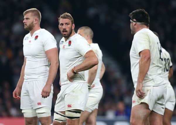 Chris Robshaw, second right, shows his disappointment after losing to Australia during the group stages of the World Cup.