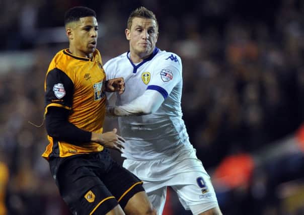 Hull City's Curtis Davies, left, battles with Leeds United's Chris Waood in the recent Yorkshire derby at Elland Road. Picture: Jon Gawthorpe.