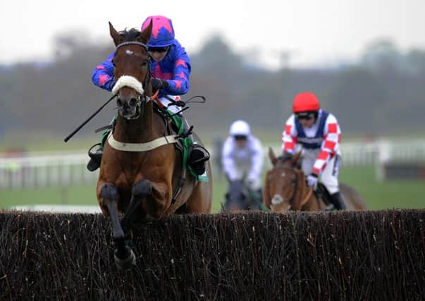 Cue Card, with Paddy Brennan on board, jumps the final fence on they way to winning the bet365 Charlie Hall Chase at Wetherby in October (Picture: John Giles/PA Wire).