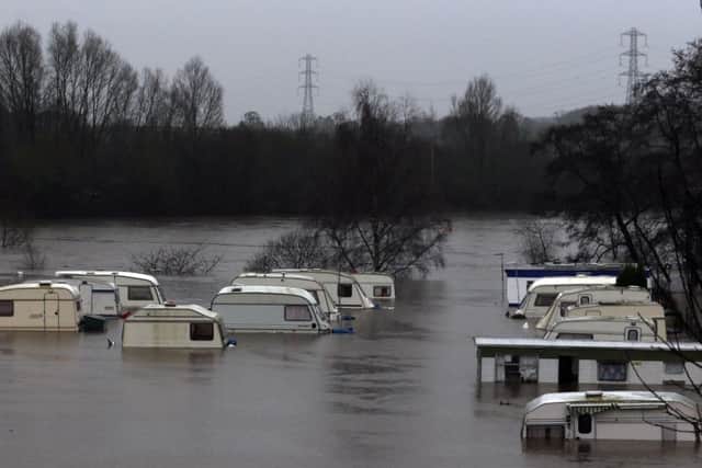 A caravan park inundated by flood water after the River Nidd burst its banks in Knaresborough, North Yorkshire. PRESS ASSOCIATION Photo. Picture date: Saturday December 26, 2015. See PA story WEATHER Floods. Photo credit should read: Owen Humphreys/PA Wire