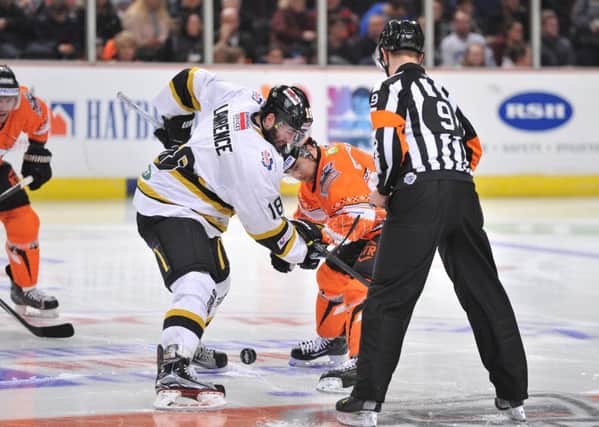 TIGHT DUEL: Sheffield Steelers' Jeff Legue, right, faces off against Nottingham's Chris Lawrence, a former Steelers' team-mate, on Boxing Day. Picture: Dean Woolley.