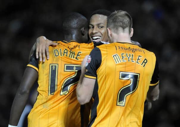 Hull City striker Abel Hernandez is congratulated on his goal by David Meyler and Mo Daime (Picture: Bruce Rollinson).