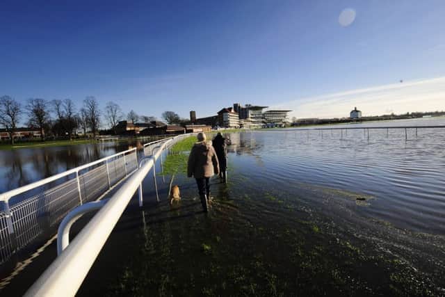 The Knavesmire Racecourse in York covered in floodwater after  the River Ouse bursts its banks. John Giles/PA Wire