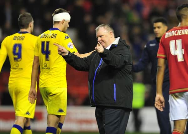 Leeds United head coach Steve Evans applauds the travelling support following his side's 1-1 draw at Nottingham Forest (Picture: Tony Johnson).