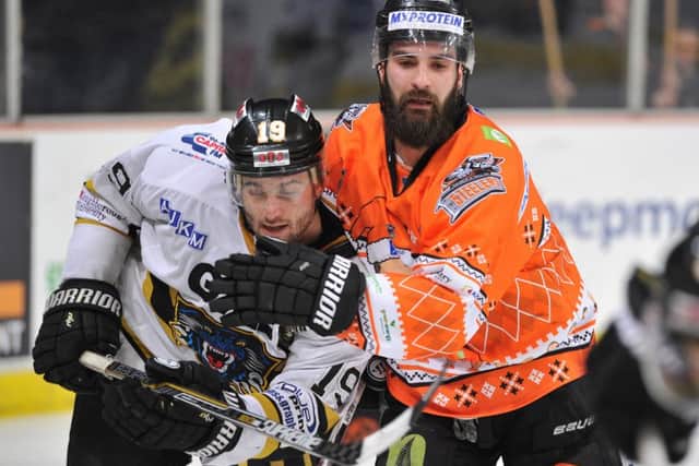 Mathieu Roy, seen battling against Nottingham's Robert Farmer on Saturday night, was missing from the Sheffield Steelers' line-up for the following night's return match at the NIC. Picture: Dean Woolley.
