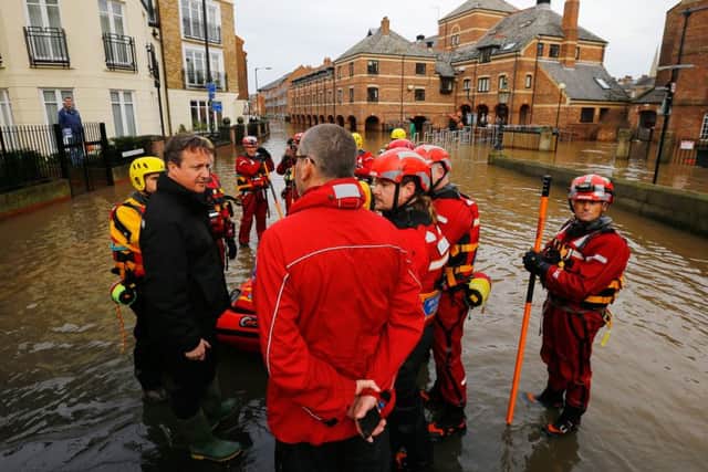 Prime Minister David Cameron greets soldiers working on flood relief in York city centre. Photo: Darren Staples/PA Wire
