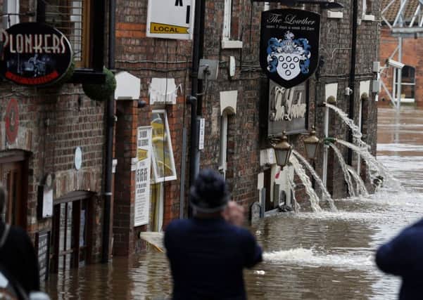 Flood water is pumped out of pubs in York on December 28. Picture: Owen Humphreys/PA Wire