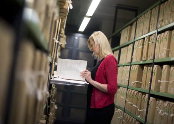 A member of staff in the repositories of the National Archives in Kew, as a number of papers dating from the 1980s have been released. PIC: PA