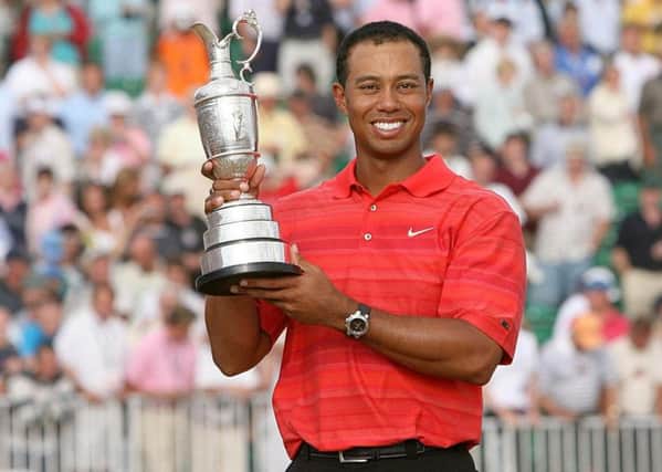 Tiger Woods lifts the claret jug after winning the 135th Open Championship at Royal Liverpool Golf Club, Hoylake, in 2006.