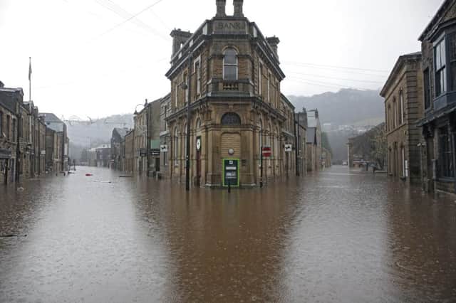 Boxing day flood in Hebden Bridge. Lloyds Bank an island in Albert Street.