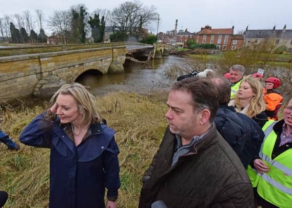 Environment Secretary Elizabeth Truss, by Tadcaster's partially collapsed bridge.