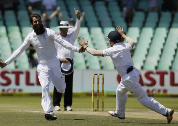 Englands Moeen Ali, left, celebrates the fall of another South Africa wicket with team-mate James Taylor, in Durban. AP /Themba Hadebe.