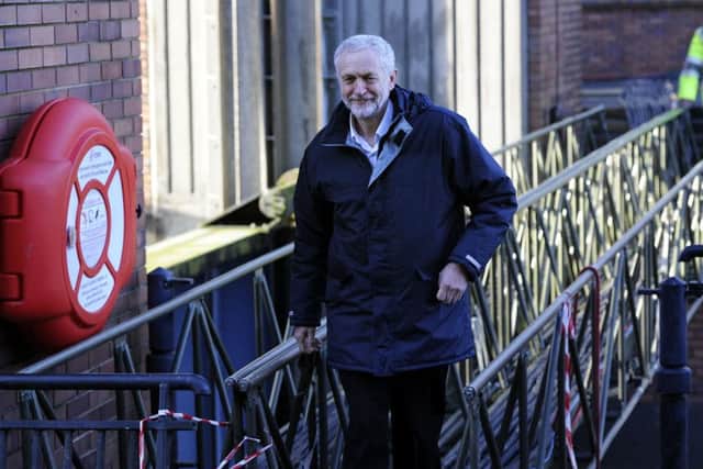 Labour leader Jeremy Corbyn walks across a foot bridge at the Foss Barrier, during his visit to view flood affected areas in York.