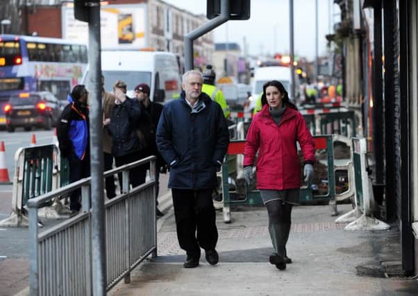 Leader of the Labour Party Jeremy Corbyn chats to Leeds Labour MP Rachel Reeves, as they walk down Kirkstall Road where small businesses were affected by the floods.   Picture: Jonathan Gawthorpe