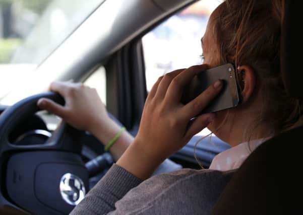 Driving while using a mobile phone is just as dangerous as drink driving.