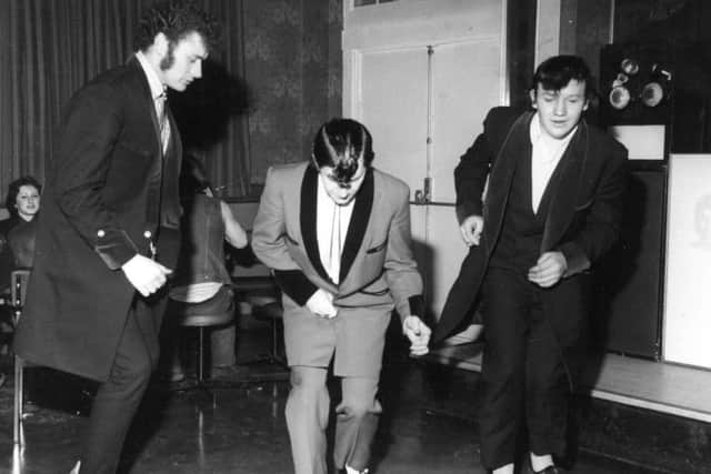 Teddy boys bopping on the dance floor at the Wykebeck Arms in Leeds in 1974.