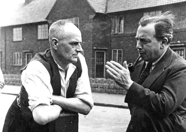 At Armthorpe's Markham Main colliery, JB Priestley discusses a point with Gerry  Margerison