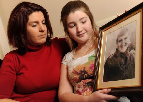 Karen Still comforts her daughter Rebecca whose brother Jamie was killed in Otley in an accident which has prompted calls for motoring laws to be tightened.
