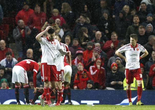Sheffield United's players show their frustration after Manchester United are awarded a late penalty at Old Trafford on Saturday. Picture: Sport Image.