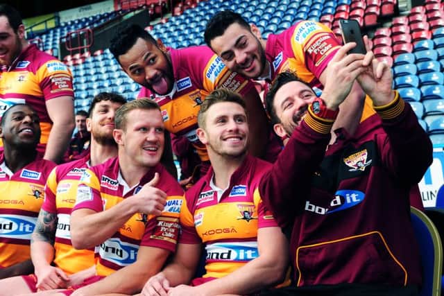 Huddersfield Giants have a laugh while waiting for the team photograph to be taken (Picture: Jonathan Gawthorpe).