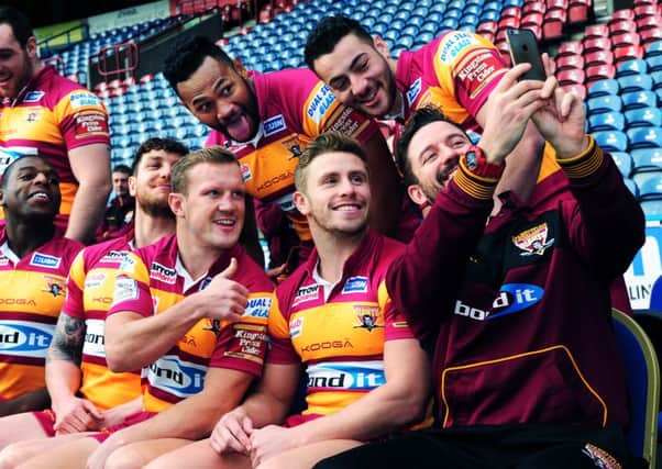 Huddersfield Giants have a laugh while waiting for the team photograph to be taken (Picture: Jonathan Gawthorpe).