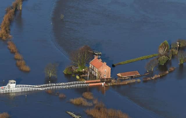Floodwater surrounds houses in Cawood, North Yorkshire after the River Ouse burst its banks. PRESS ASSOCIATION Photo. Picture date: Sunday December 27, 2015.  Photo: Joe Giddens/PA Wire