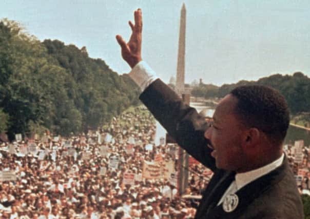 The Rev. Martin Luther King Jr. acknowledges the crowd at the Lincoln Memorial for his "I Have a Dream" speech during the march on Washington, D.C. in this Aug. 28, 1963 file photo.  The march was organized  to support proposed civil rights legislation and end segregation.   (AP Photo)